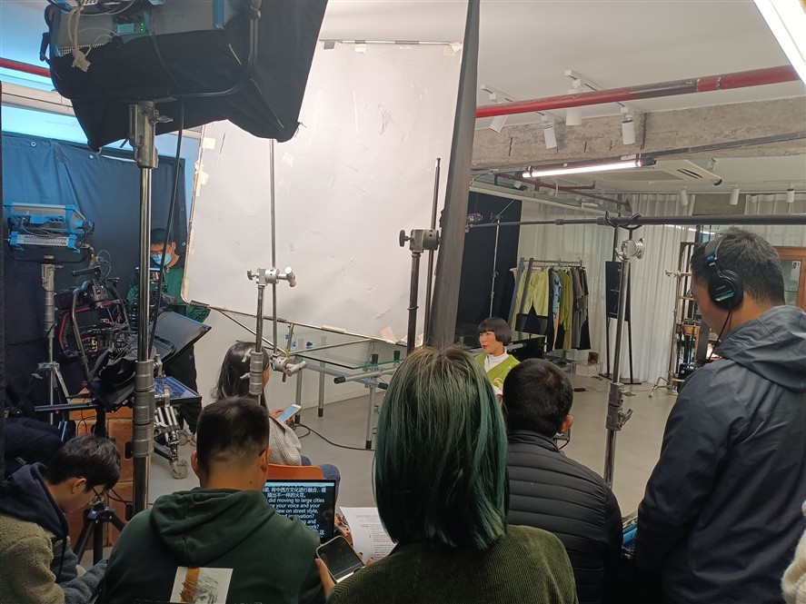 Nanjing production crew reviewing a shoot on location