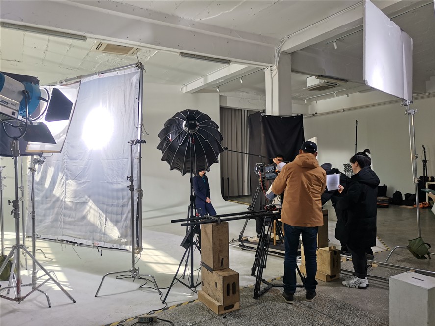 Nanjing production team preparing camera and lighting gear